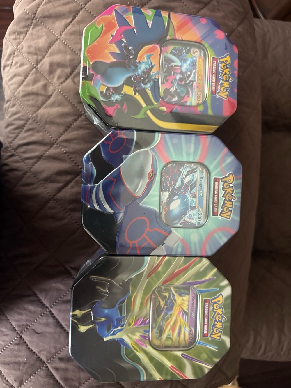 Pokemon Tin Set with Blue, Green, Purple and Black Artwork